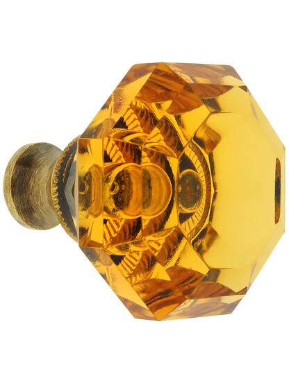 Amber Lead-Free Octagonal Crystal Knob with Solid Brass Base in Antique Brass.